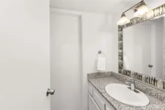 Half bathroom on the main floor. Door into mechanical room.