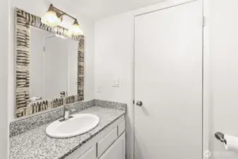 Another view of the half bathroom. This door leads to the utility room.