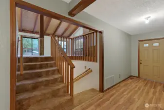 Entry Main Floor - with stairs to upper level Family Room