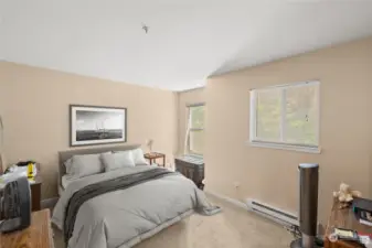 Private entry into the primary bedroom that will easily accommodate a Queen or King bed and additional furniture.  One large walk-in closet and another standard closet for his or her clothes, shoes etc. View of greenbelt area from both windows. Privacy plus here!