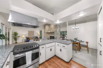 The kitchen with a view of the living and dining area