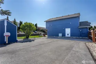 Sport court/RV parking behind the fence.