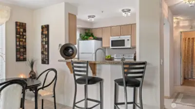 Convenient breakfast bar provides additional dining space