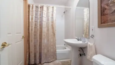 Full bath is ensuite to bedroom #2 and also accessed by the hallway