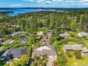 Enjoy panoramic views of mountains, lake, and skyline that invigorate your days in this beautifully renovated daylight rambler.