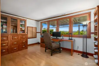 the den/office has built-ins and large view windows.