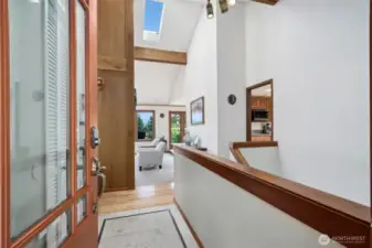 The tiled entry leads to the vaulted living room