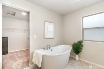 En Suite looking into walk in closet space