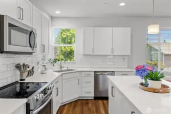 Stainless Steel appliances, quartz countertops, and soft close cabinets.