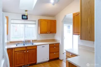 Kitchen overlooks the backyard.