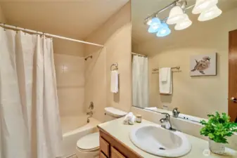 The hall bath offers a (non-jetted) soaking tub and lots of storage.