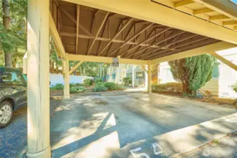 The unit is assigned parking spot #54 in the covered carport. You can see the entrance to the unit right behind the parking spot.
