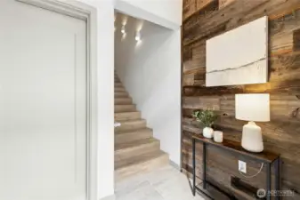 A roomy entryway greets your guests and welcomes you home. The door to the left goes to your attached two-car garage.