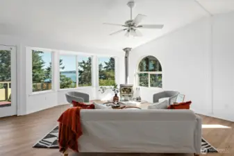 Large living room with expansive views and a wood stove to keep you cozy warm in the winter!