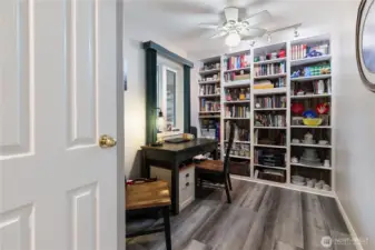 Across the hall from the kitchen is the den. A great place to work, study or relax...