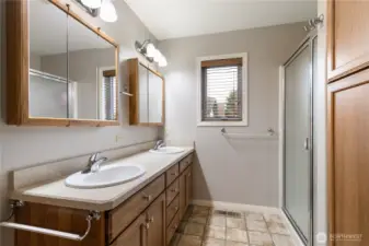 Primary onsuite has a large walk-in shower, dual vanity and plenty of linen storage...