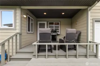 Outside you see the covered deck with obvious room for sitting and bar-b-q's...