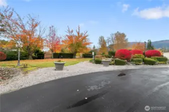 Across from the home and to the North is the balance of the park with a trail, pond, lounging area and room to park a couple of vehicles.