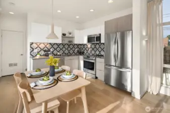 Cooking is always fun in this well appointed kitchen. Stainless appliances include range, refrigerator, dishwasher and microwave.