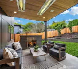 Outdoor covered living area with fireplace