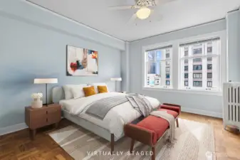 Spacious bedroom with downtown views!  Virtually Staged.