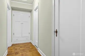 Hallway to full bath, and spacious bedroom.   The closet at the end of the hall offers loads of additional storage space.