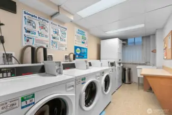 Shared laundry located on the lower floor.