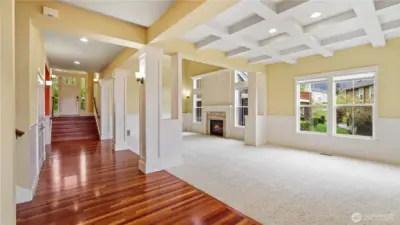 Make a grand entrance onto gleaming hardwood floors, surrounded by stunning architectural woodwork.