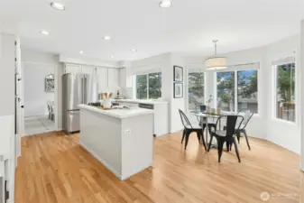 Recently refinished hardwoods throughout the entry and kitchen area.