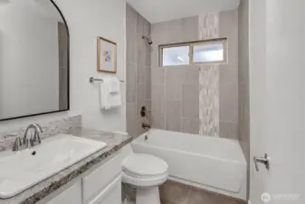 2nd/Guest bath is perfectly remodeled to reflect the same quality as the other rooms of the home. Custom tile, lighting, fixtures....and paint! Move-in ready!