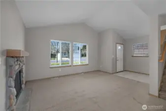 Vaulted ceiling and cozy gas fireplace makes the living room very inviting.