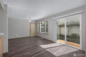 The dining nook area leading to family room