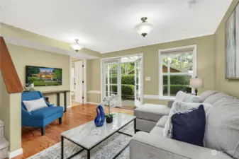 The cheery daylight lower level includes a home office space and a cozy family room with French doors leading to the garden. Rich, golden oak engineered hardwoods throughout the lower level.