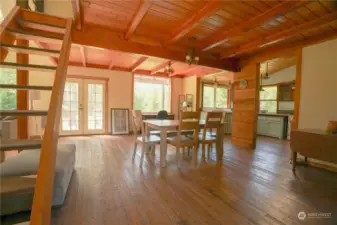 Kitchen area with stairs to the loft above.