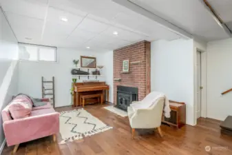 Family room is perfect for everyone to spread out a bit, with a wood-burning stove.