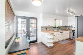 French doors lead to another eating space on large deck.