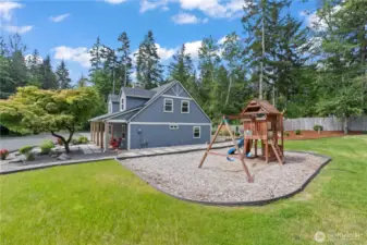 Beautiful updated farmhouse-style home with charming curb appeal, wide front porch, and mature landscaping. Adjacent play area with swings and slide offers the perfect setup for kids. Tucked away in a quiet, forested setting, this home boasts privacy, outdoor recreation, and a welcoming layout—ideal for family living in the Pacific Northwest.