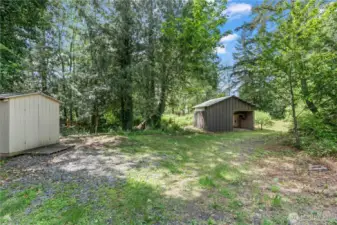 This serene property features a functional horse barn and an additional storage shed, offering endless potential for hobby farming, equestrian use, or outdoor projects. Surrounded by mature evergreens and with direct trail access into the woods, it's a dream setup for anyone seeking a peaceful, country lifestyle with room to roam and explore.