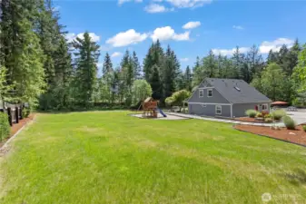 Enjoy the freedom of a fully-fenced, oversized grassy yard that’s perfect for kids, pets, and outdoor activities. The lush green lawn and established plants are maintained with a fully automated sprinkler and irrigation system, making upkeep effortless. Beautiful bark beds, elegant hardscaping, and mature landscaping create a serene outdoor retreat with plenty of space for play, gardening, or future outdoor projects.
