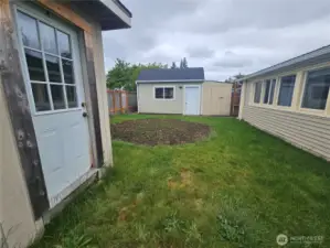 Enclosed Backyard with Outbuildings