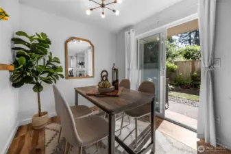 Very comfortable dining area with your glass slider out to the patio and garden area.