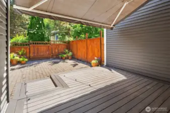 With a large retractable awning, vibrant flower pots, and glowing Italian string lights, it’s an ideal entertainment space by day and a serene haven by night.
