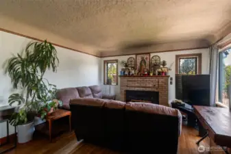 original hardwood floors and wood fireplace with insert. Check out the coved ceilings
