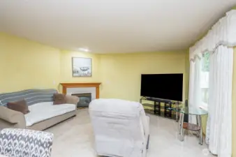 Great room offers a gas burning fireplace with a wood mantel and off the kitchen area.