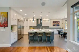 The kitchen is well equipped with professional grade appliances, a 48" Sub-Zero refrigerator, Asko dishwasher, Kobe hood fan and a Miele 6 burner dual fuel stove and an oven with steam function.  The cubby to the left of the refrigerator is designed as a coffee station! And the cabinet above the coffee nook can accomodate a microwave.