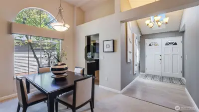 The home has a double door entry with a soaring ceiling.  It stays bright and airy with plenty of natural light.