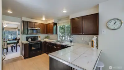 The kitchen is well designed with an open felling.  The kitchen has been updated with a modern sense.