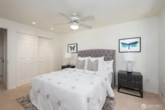 Primary bedroom with ceiling fan