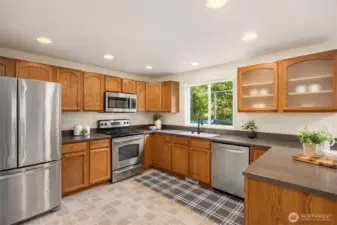 Generous kitchen with newer stainless appliances.