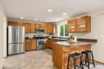 Breakfast bar expands the use of the generous countertops.